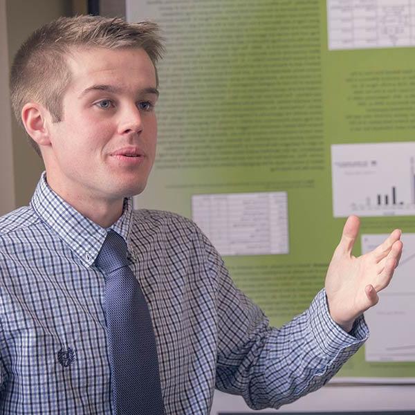 Male student participating in Celebrate Carroll academic conference